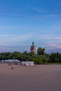 View of beach against cloudy sky