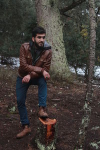 Full length portrait of young man in park