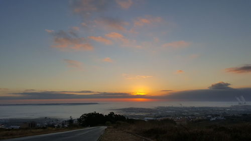 Scenic view of sunset over calm sea