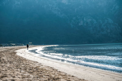 Person walking on beach