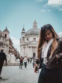 Full length of woman standing in city