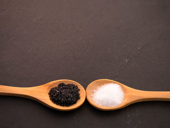 Close-up of cake on table against black background