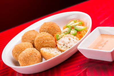 Close-up of fried food in bowl on table