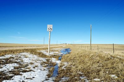 Rural countryside, speed limit signs appear infrequently 