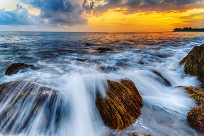 Scenic view of sea against sky during sunset