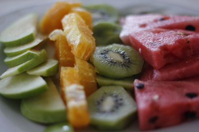Close-up of chopped fruits in plate