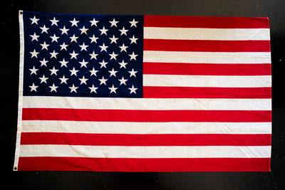 Low angle view of flag against blue sky