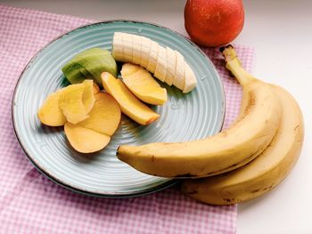 High angle view of fruits in plate on table