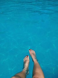 Low section of woman in swimming pool