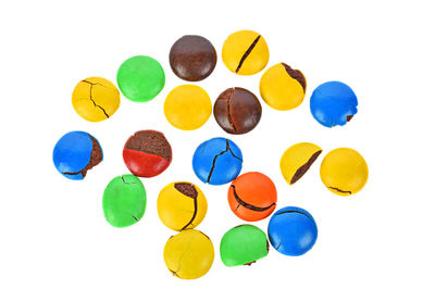 Directly above shot of multi colored candies over white background
