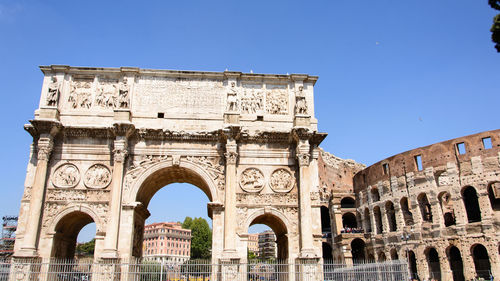 Low angle view of the arch of constantine, a historical building in rome against sky