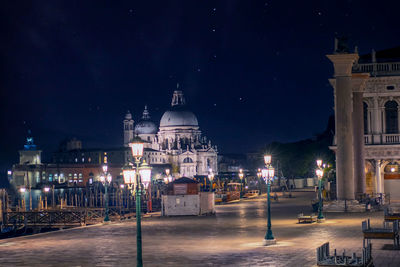 Illuminated buildings in city at night