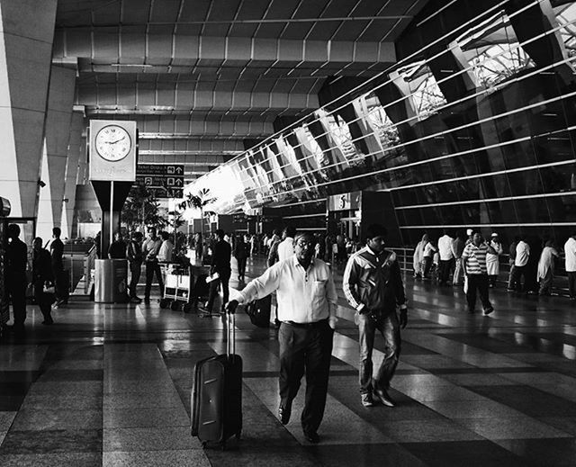 large group of people, person, men, city life, transportation, lifestyles, public transportation, walking, architecture, railroad station, built structure, city, indoors, text, subway station, passenger, travel, crowd, illuminated