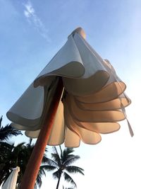 Low angle view of clothes hanging against sky