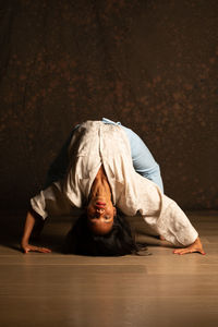 Portrait of a young man lying down on floor