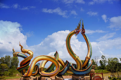 Low angle view of statue against sky