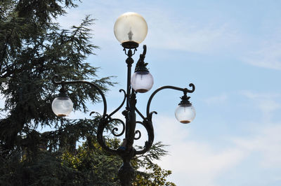 Low angle view of street light against sky