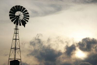 Low angle view of windmill against sky