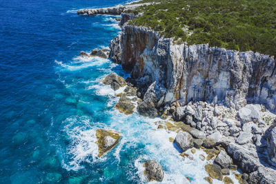 High angle view of rocks in sea