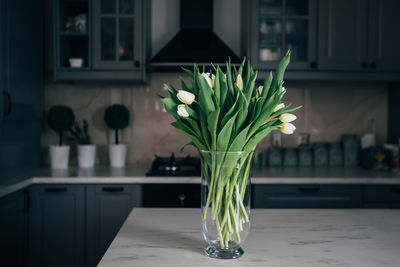 Close-up of flower vase on table at home