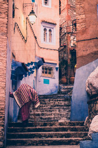 Man in front of building