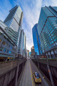 Low angle view of modern buildings against sky