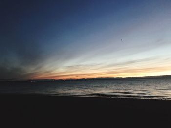 Scenic view of sea against sky at sunset
