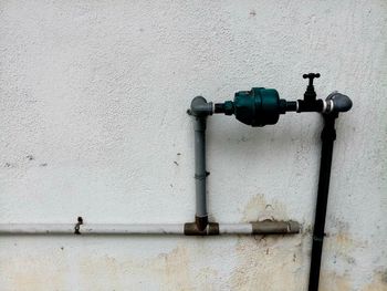 Close-up of pipes against wall