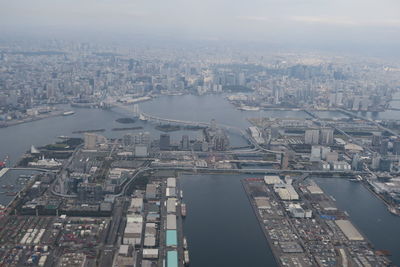 High angle view of buildings in city against sky