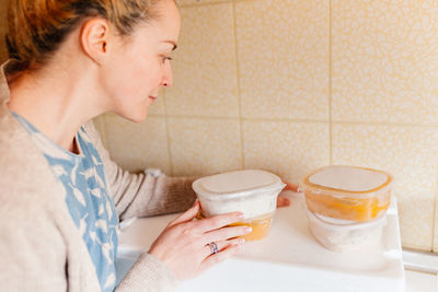 Side view of a woman drinking coffee