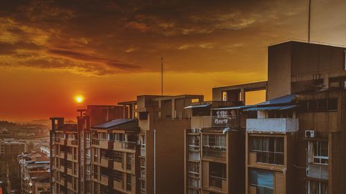 Cityscape against sky during sunset