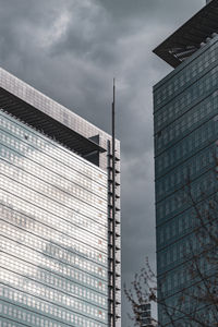 Low angle view of modern buildings against sky