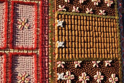 High angle view of candies on wooden wall