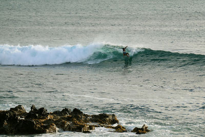 High angle view of man surfing on sea