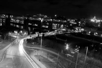 High angle view of light trails on road at night