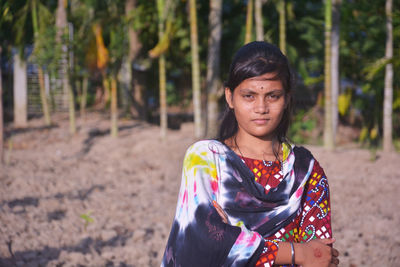 Portrait of woman standing on land