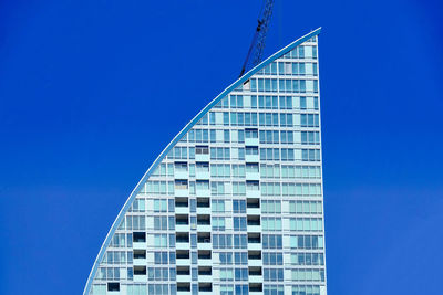 Low angle view of building against blue sky