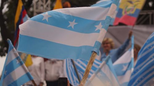 Close-up of flags against blue sky