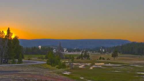 Scenic view of landscape against sky during sunset