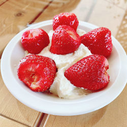 High angle view of strawberries in plate on table