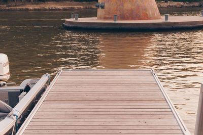 Boat sailing on river by pier