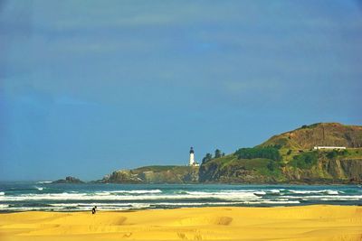 Scenic view of sea against blue sky