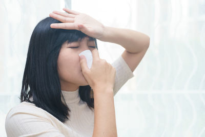 Young woman suffering from cold and flu