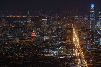 High angle view of illuminated buildings in city at night