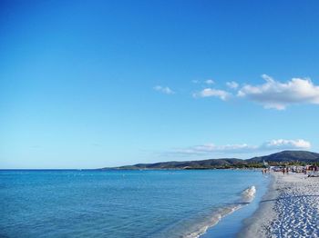 Scenic view of sea against blue sky