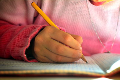 Close-up of hand holding book