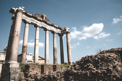 Low angle view of old ruins against sky