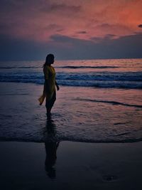Full length of woman on beach during sunset