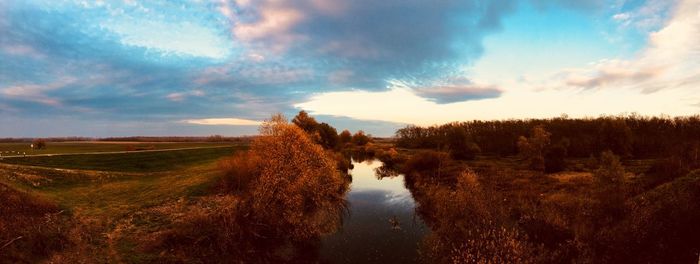 Panoramic shot of field against sky