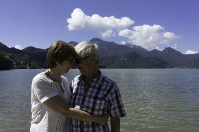 Rear view of woman looking at lake